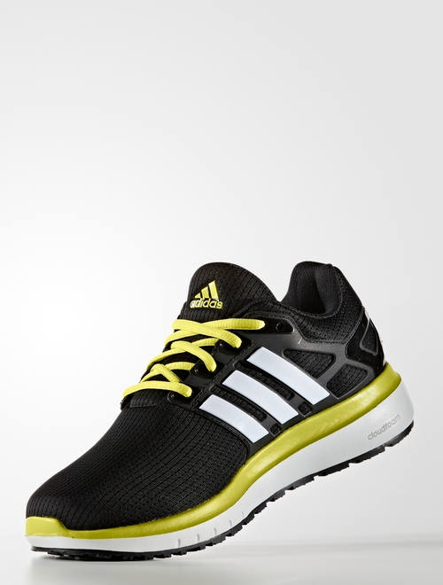 black and yellow athletic shoes